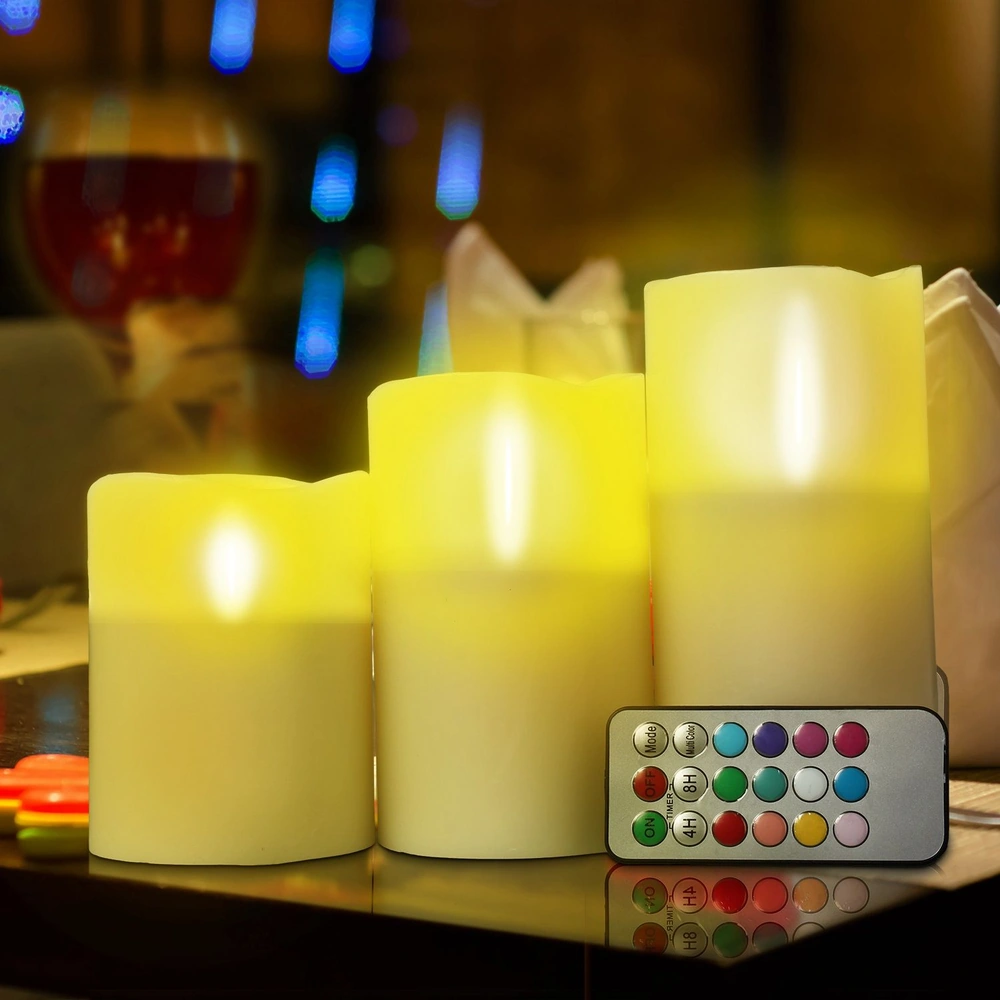 Set of three LED flameless candles glowing softly with a remote control for color and timer options, perfect for home decor and ambiance lighting.