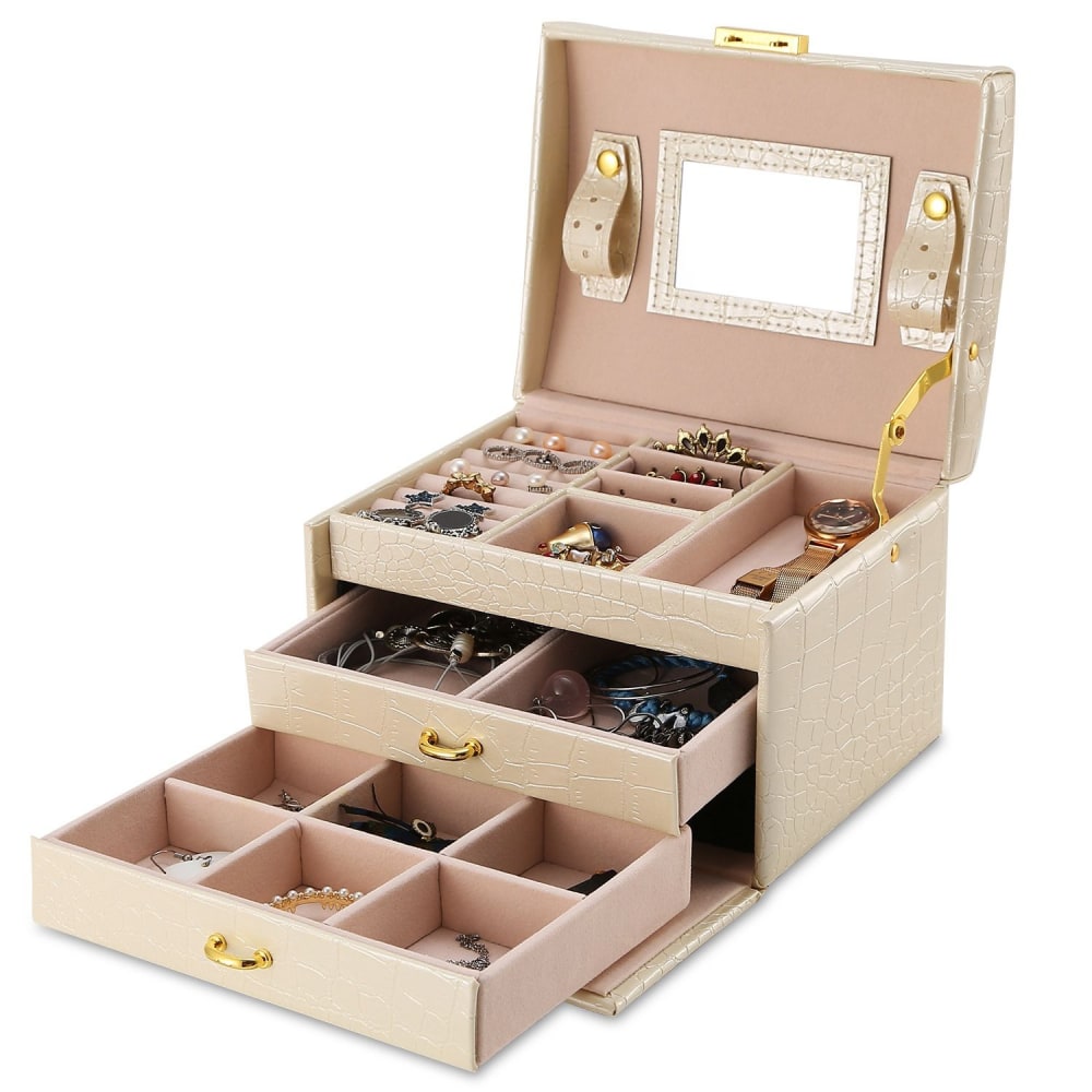 Elegant jewelry box in beige faux leather with gold accents, featuring multiple compartments and drawers for organized storage of earrings, rings, necklaces, and bracelets.