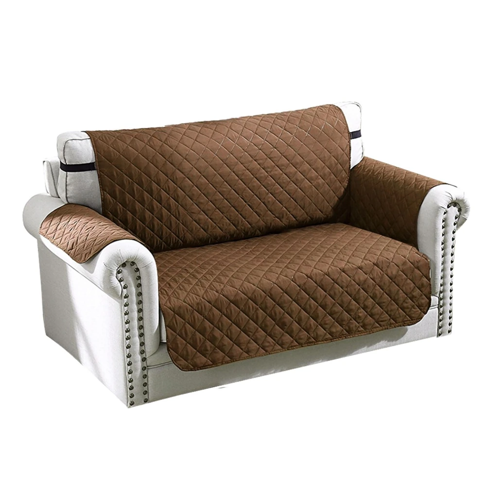 Brown quilted sofa cover draped over a white upholstered couch, showcasing a protective and stylish accessory for home furniture.