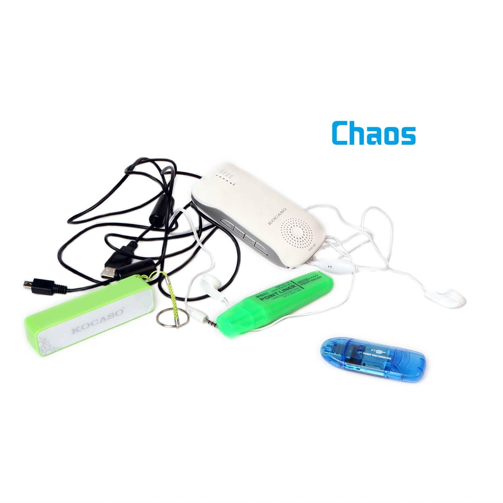 A chaotic arrangement of electronic accessories including a white portable speaker, tangled black and white earphone wires, a green highlighter, a green flashlight, and a blue USB drive, all on a clean white background.
