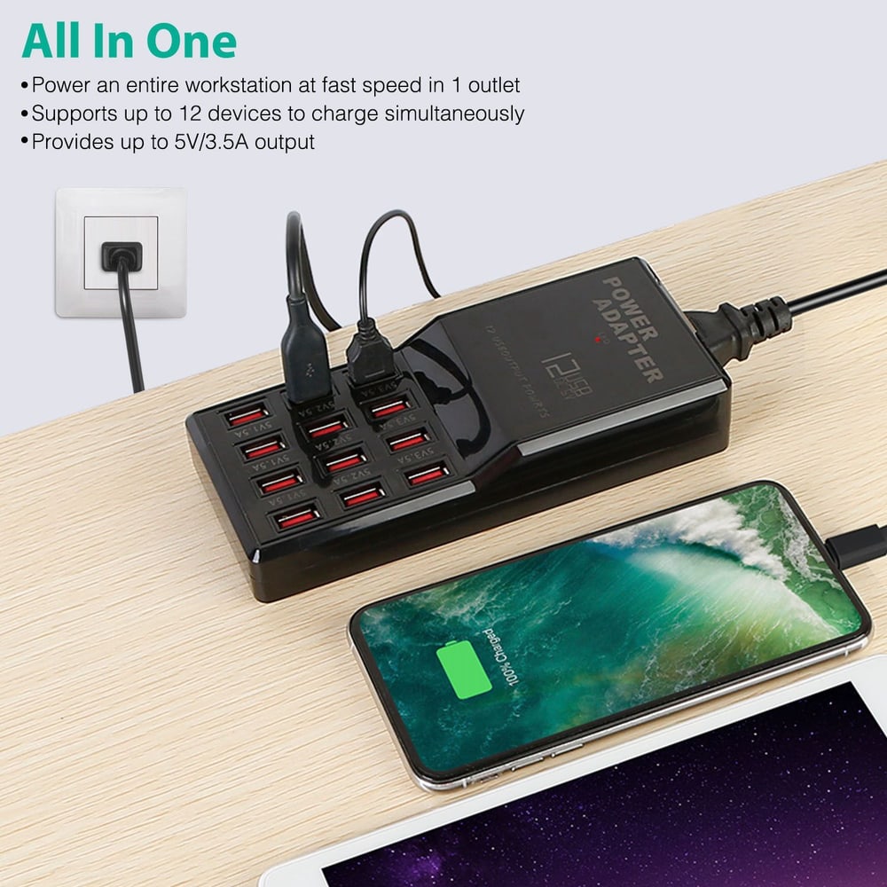 Power adapter with 12 USB ports charging multiple devices simultaneously, featuring a smartphone and tablet on a wooden surface, showcasing fast charging capabilities.