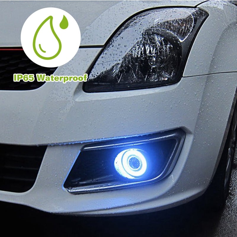 IP65 waterproof car fog light with blue halo ring on a white vehicle, illuminated in rainy conditions.