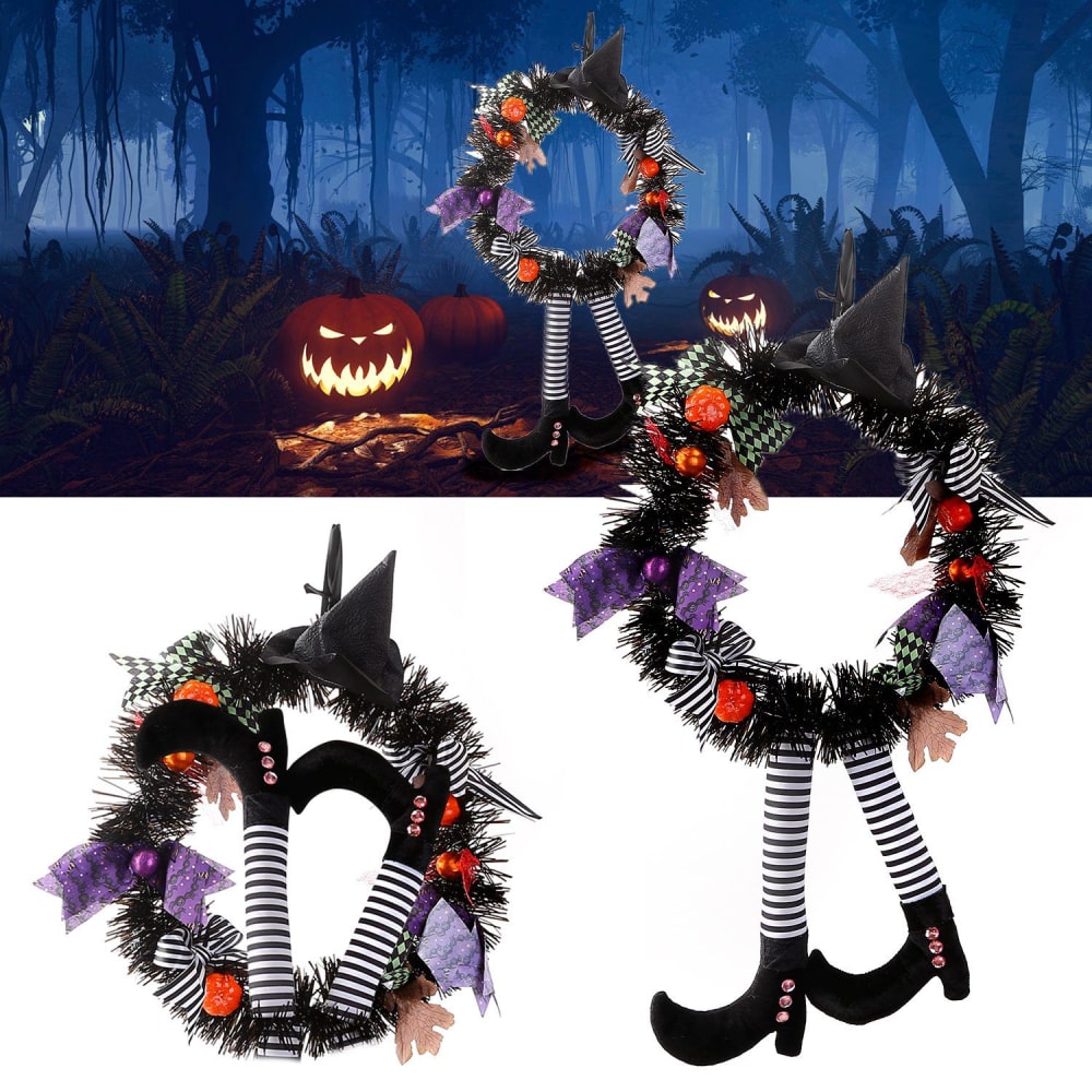Halloween witch wreath with black tinsel, purple and orange decorations, striped legs, and witch shoes, perfect for seasonal home decor.
