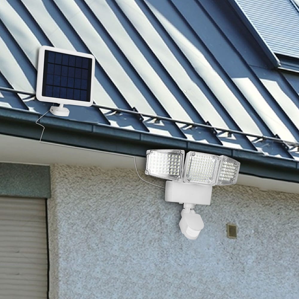 Solar-powered outdoor security light with three adjustable LED floodlights and a separate solar panel mounted on a roof.
