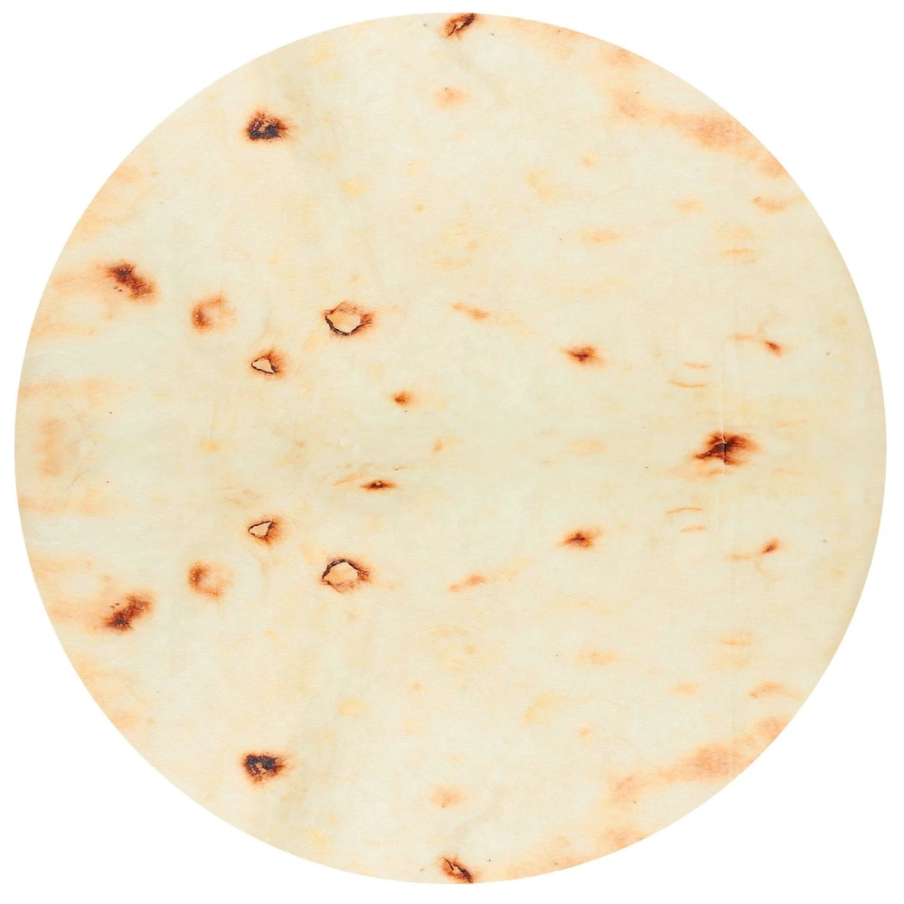 Freshly baked round flatbread with light browning and small dark spots, perfect for wraps or dipping.