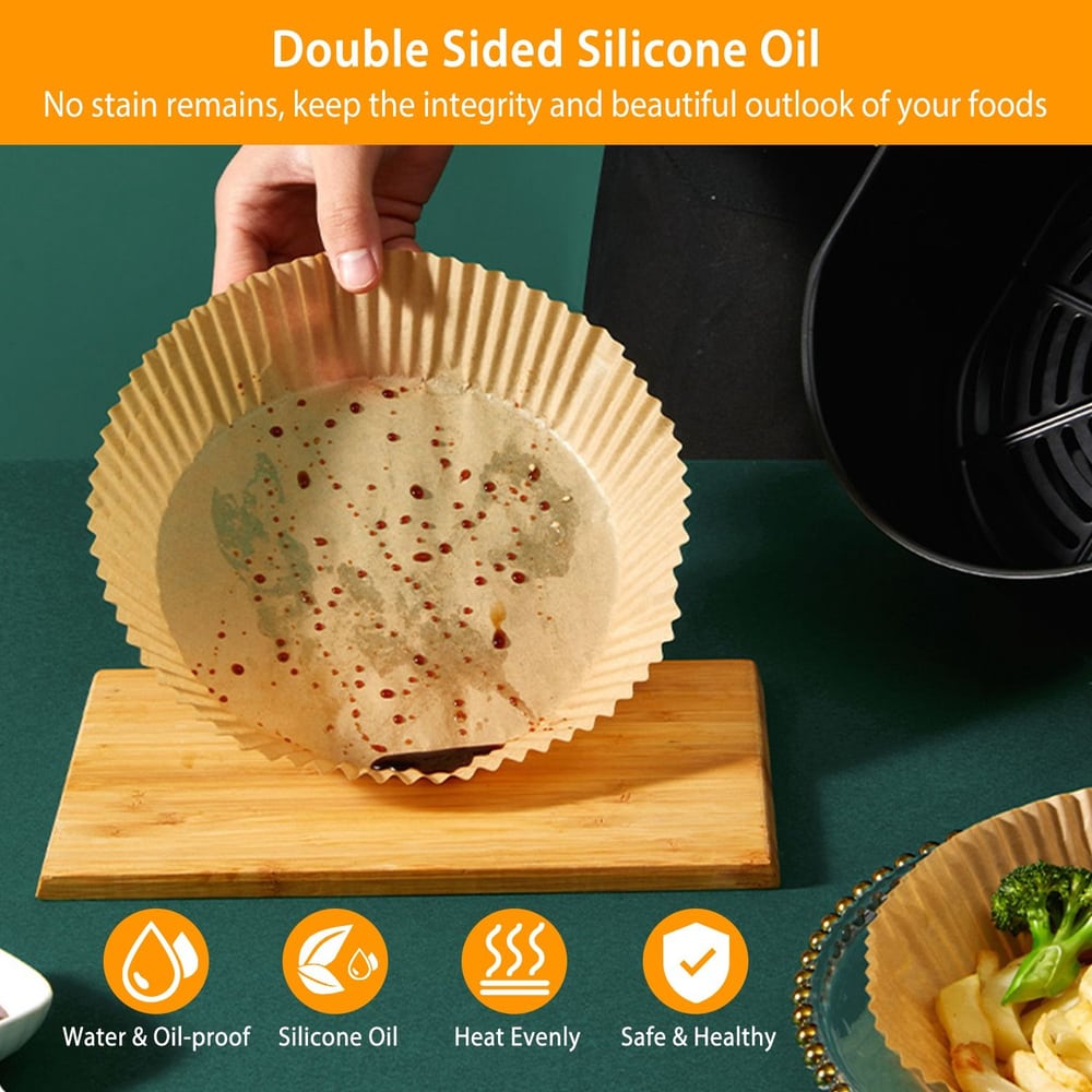 Double-sided silicone oil baking paper with a hand holding it, showcasing its water and oil-proof features, designed for easy cleaning and maintaining food presentation, suitable for air fryers.