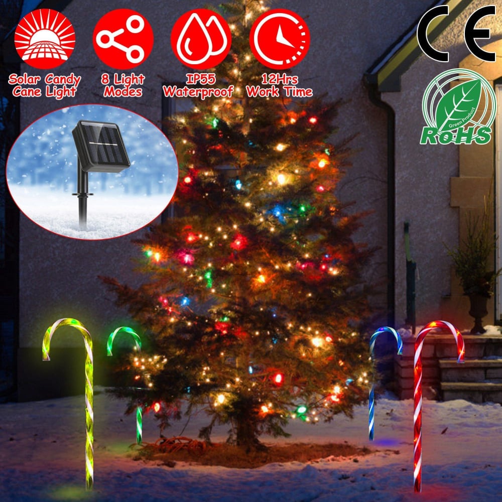 Solar-powered candy cane light decorations with vibrant colors set against a beautifully lit Christmas tree outdoors.