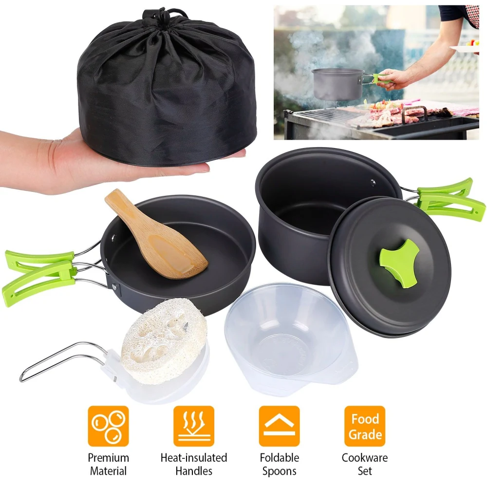 Compact cookware set featuring a portable black storage bag, aluminum pots with heat-insulated green handles, a wooden spoon, and foldable spoons, perfect for camping and outdoor cooking.