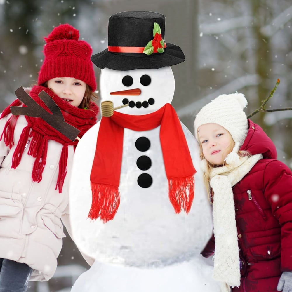 Children wearing winter clothing smiling beside a cheerful snowman adorned with a black top hat and bright red scarf against a snowy background.