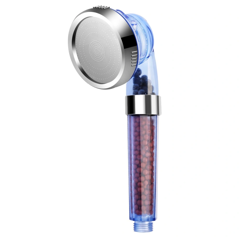 High-efficiency shower head with transparent filter housing containing colored mineral beads for water purification and enhanced shower experience.