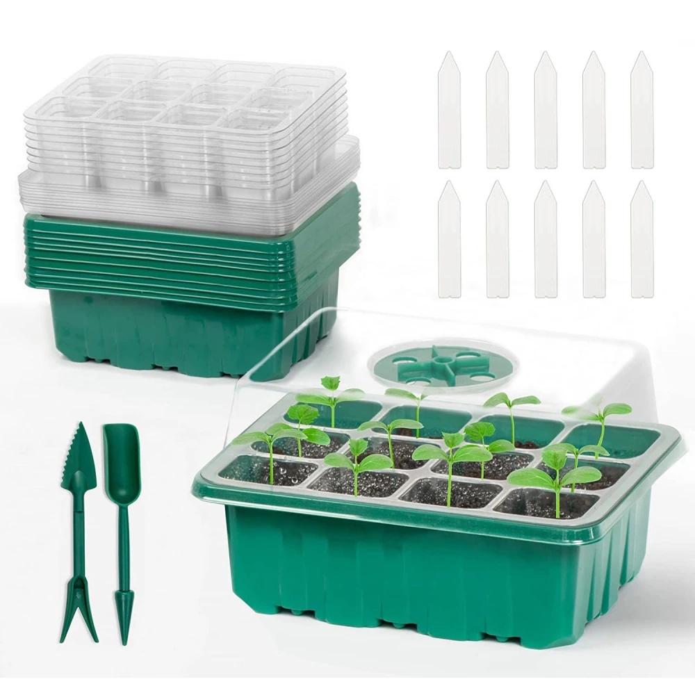 Seedling starter kit with green planting tray, transparent lid, seedling labels, and gardening tools, featuring young plants sprouting in soil pods.
