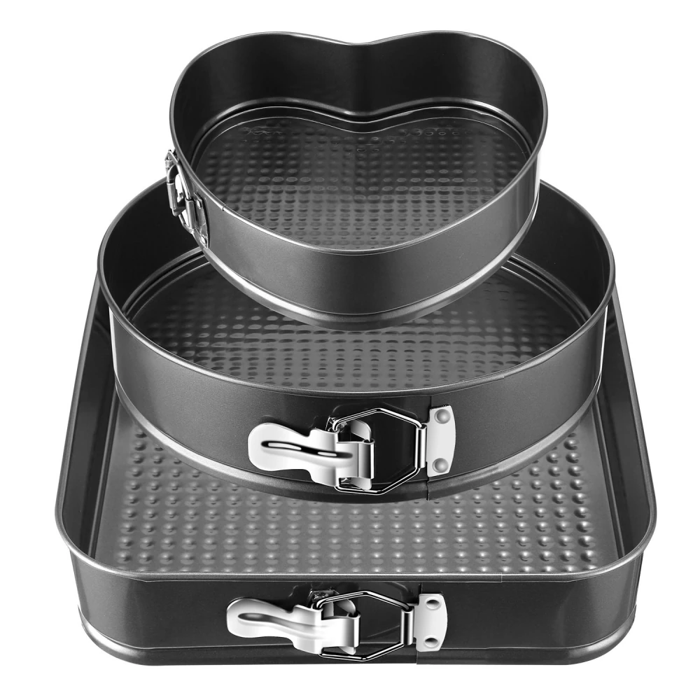 Set of three non-stick springform pans in various sizes, including a heart-shaped pan, perfect for baking cakes and desserts.