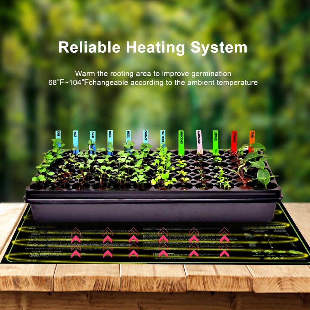 Seedlings growing in a black propagation tray on a heating mat, showcasing colorful plant labels, with a background of blurred greenery, illustrating a reliable heating system for improved germination.