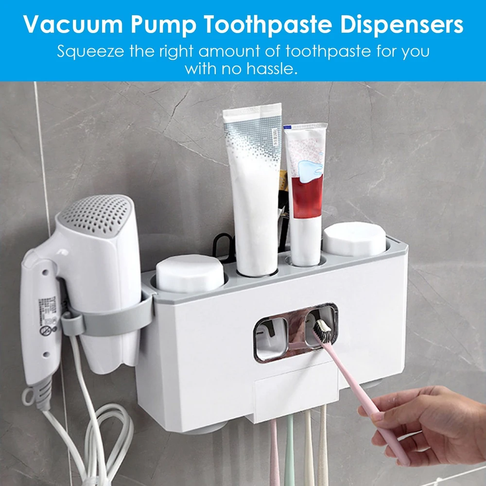 Vacuum pump toothpaste dispenser with multiple toothpaste tubes and a toothbrush, designed for easy, mess-free dispensing in a modern bathroom setting.