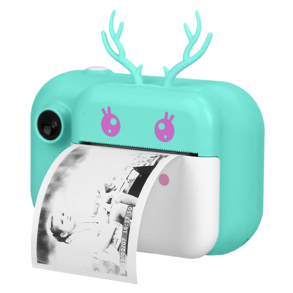 Cute turquoise photo printer with antlers, printing a black and white photo of a child, ideal for scrapbooking and instant photo memories.