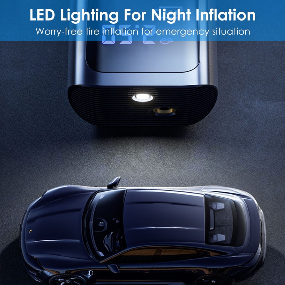 Compact tire inflator with LED light, designed for nighttime use, next to a sleek black car on a dark surface.