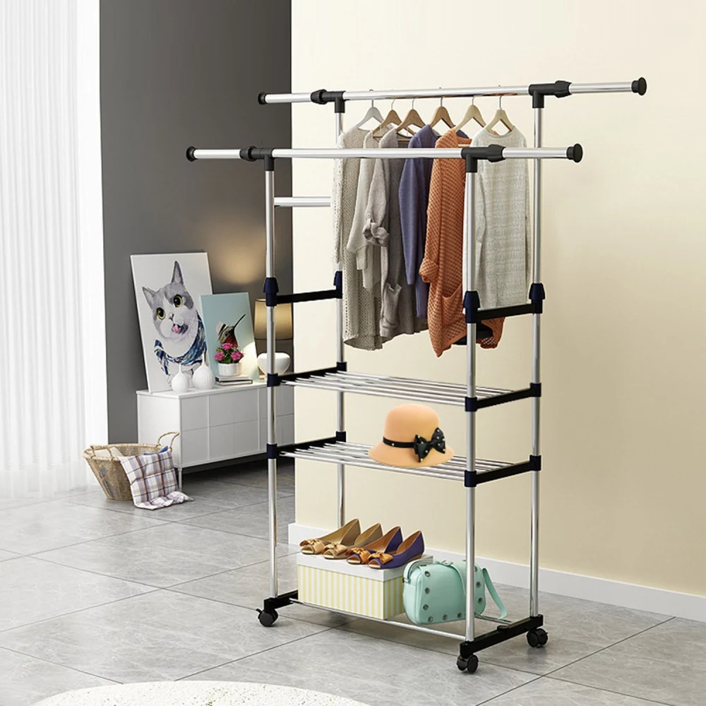 Rolling clothing rack with shelves, featuring hanging clothes, a hat, and shoes, set in a modern living space with a cat portrait in the background.