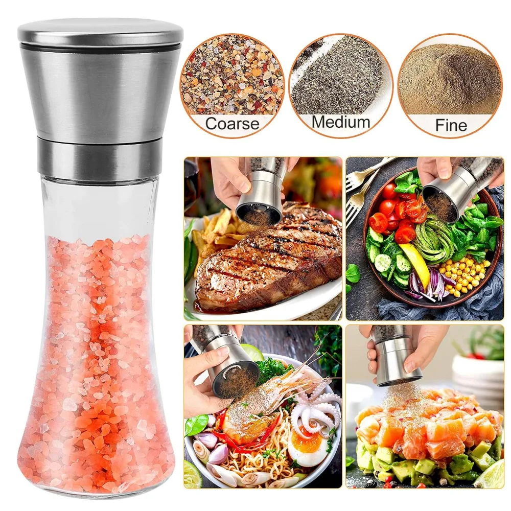 Elegant glass salt and pepper grinder with adjustable settings for coarse, medium, and fine grinding, surrounded by gourmet dishes like grilled steak, fresh salad, and seafood pasta.