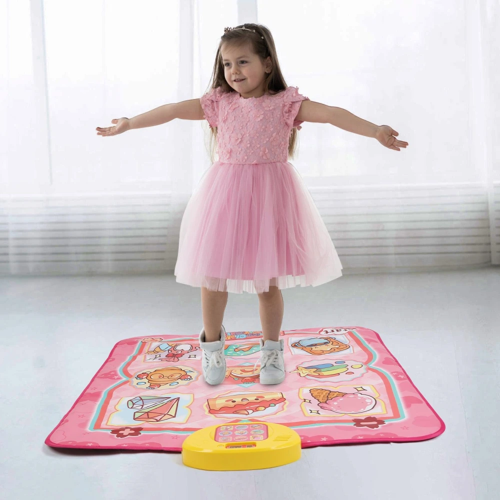 Little girl in a pink dress playing on a colorful interactive educational mat featuring fun food graphics and a yellow sound button, promoting active learning and imaginative play.