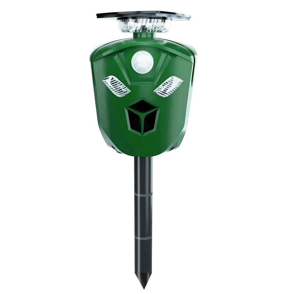 Green solar-powered motion-activated pest deterrent with a humorous face design, designed to repel animals from gardens and yards.