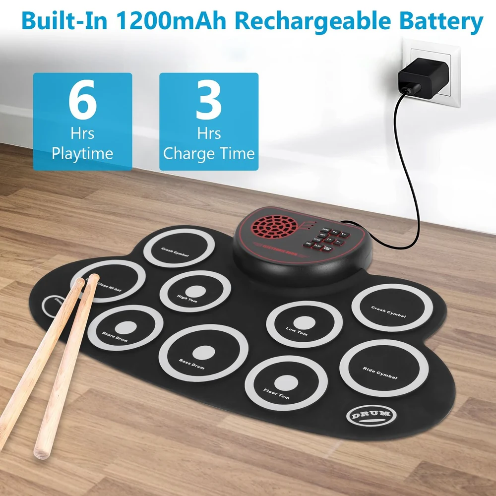 Electronic drum pad with 1200mAh rechargeable battery, features 10 sensitive drum pads, playtime of 6 hours, and 3 hours charging time, displayed on a wooden floor with drumsticks nearby.