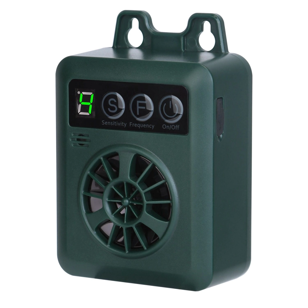 Compact green electronic device with display and buttons for sensitivity and frequency settings, designed for outdoor use.