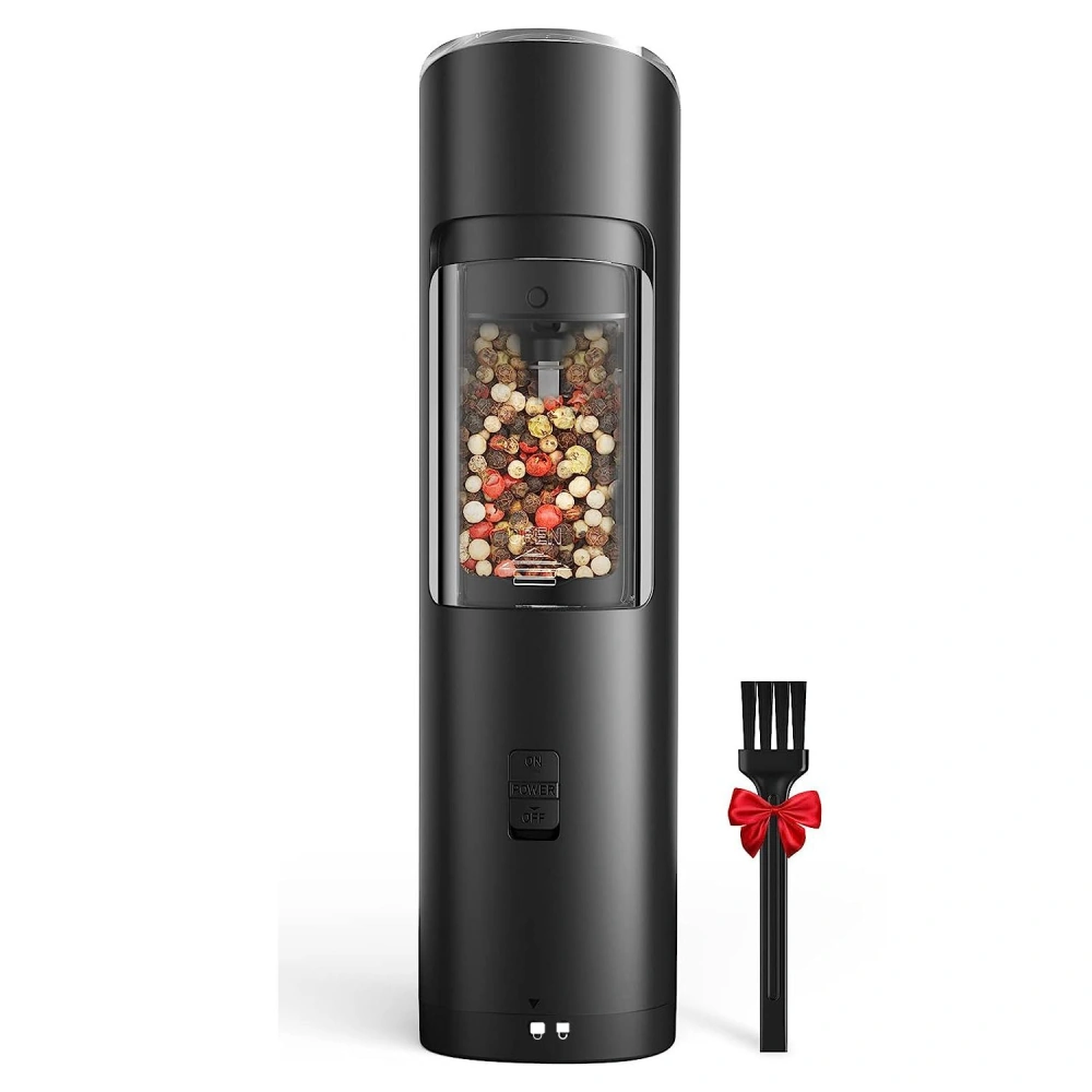 Black electric spice grinder with clear container filled with colorful spices and included cleaning brush with red bow.
