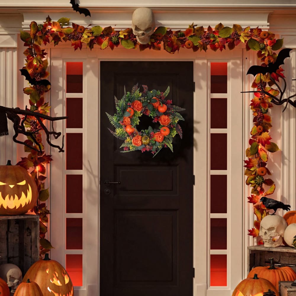 Halloween-themed front door decorated with orange and purple foliage, a vibrant floral wreath featuring orange roses and pumpkins, spooky bats, lit pumpkins, and a skull accent.