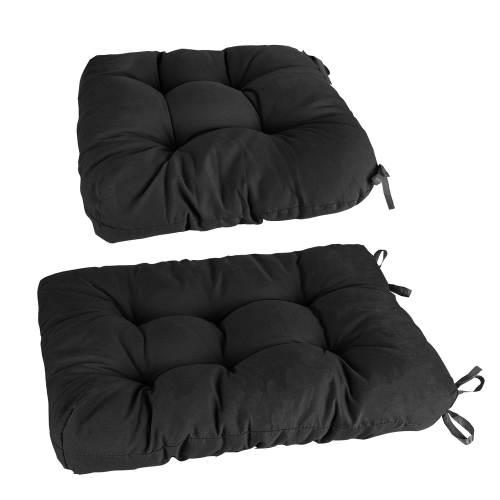 Two plush black cushion pads with tufted designs, featuring ties for easy attachment, ideal for outdoor furniture or home decor.