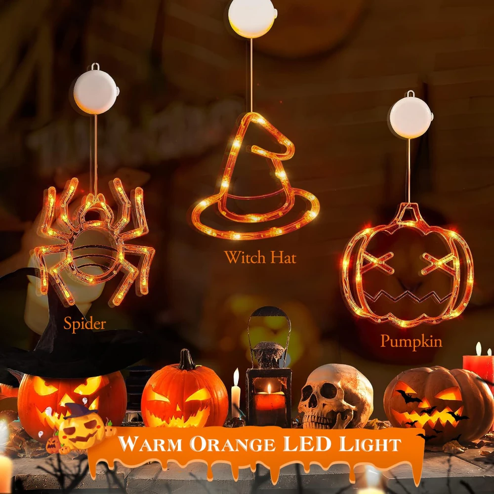 Warm orange LED Halloween light decorations featuring a spider, witch hat, and pumpkin, surrounded by carved jack-o'-lanterns and spooky candles.