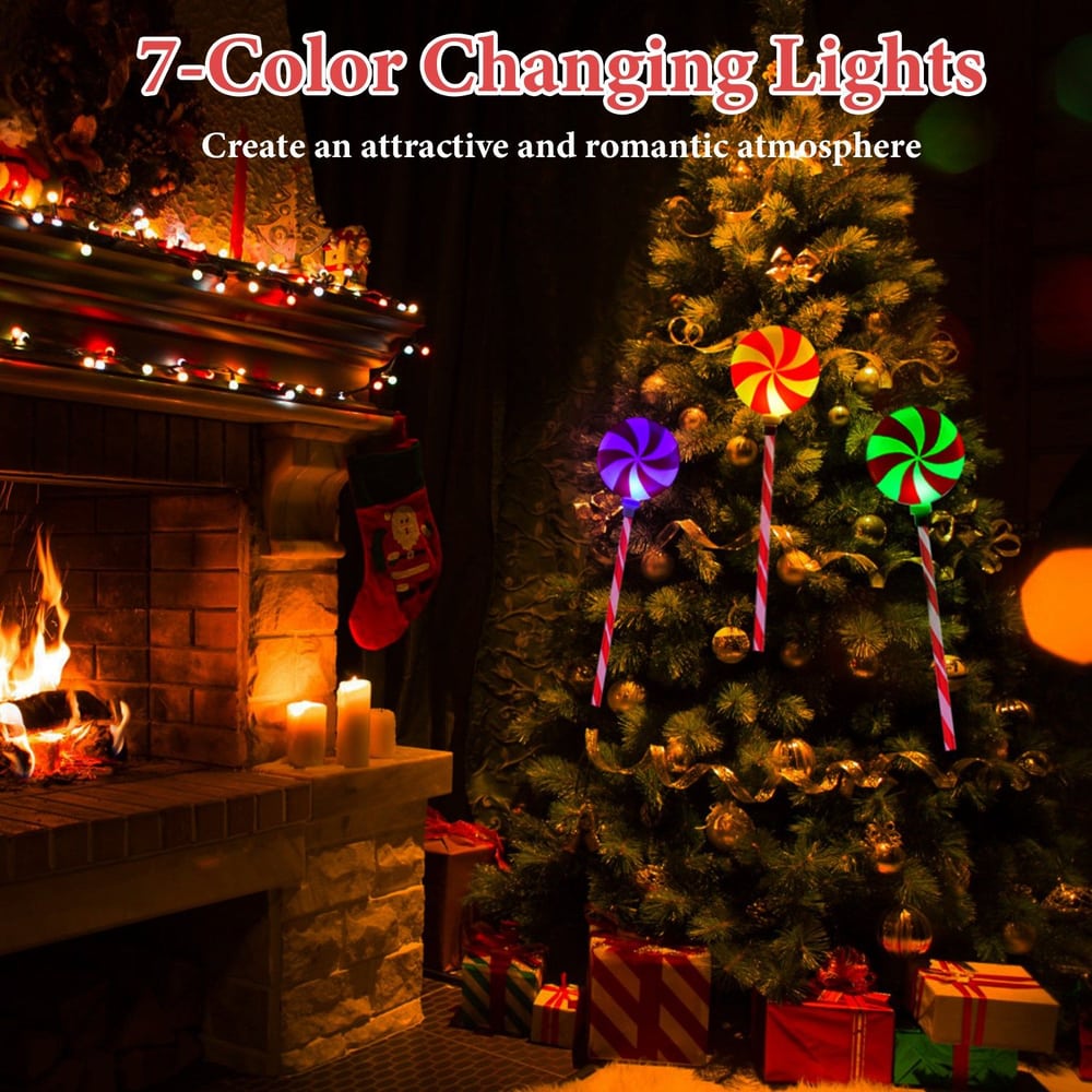7-color changing decorative lights on a Christmas tree, creating a festive atmosphere with colorful lollipops and twinkling lights near a cozy fireplace with stockings and candles.