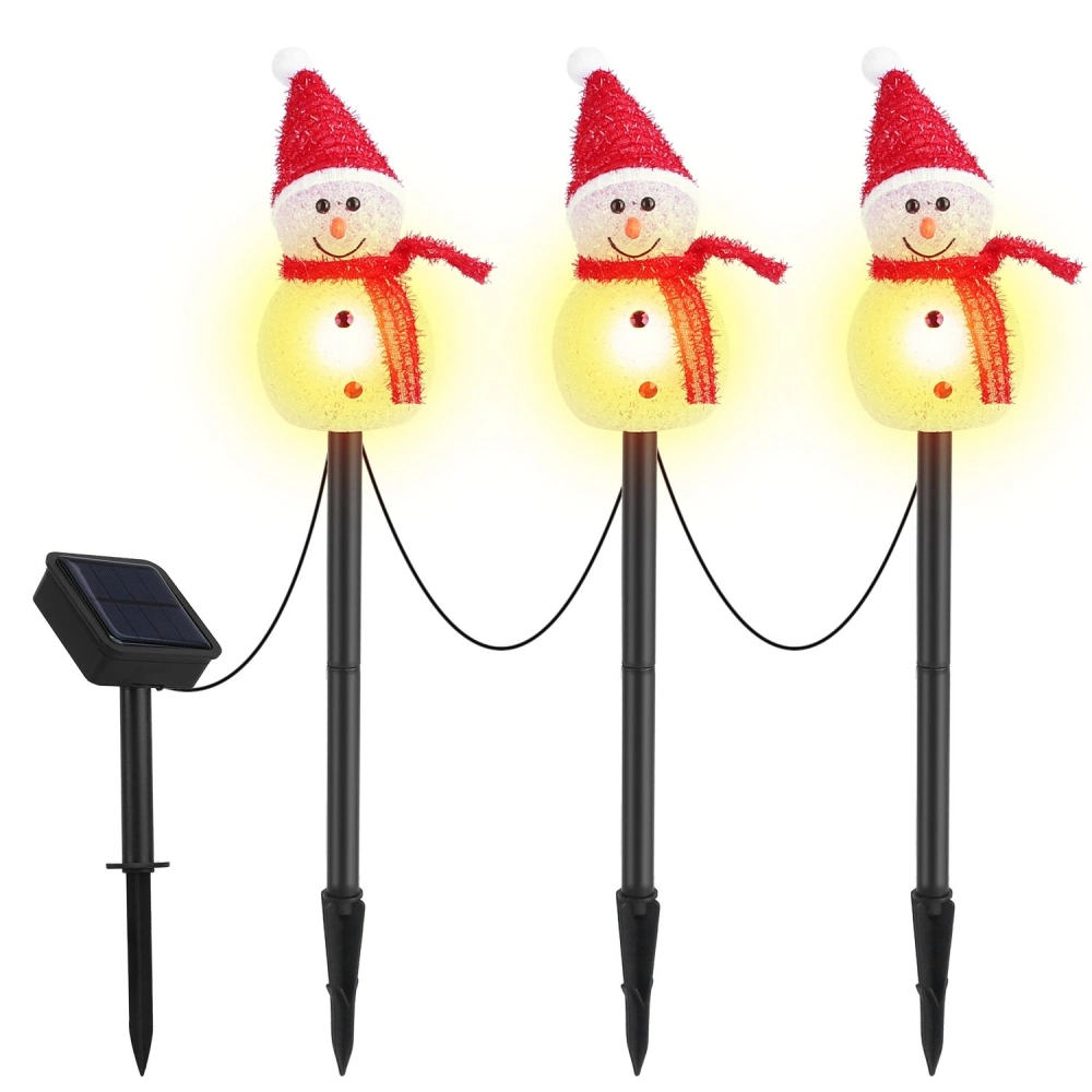 Solar-powered decorative outdoor lights featuring three smiling snowmen with red hats and scarves, emitting a warm glow, ideal for festive winter decor.