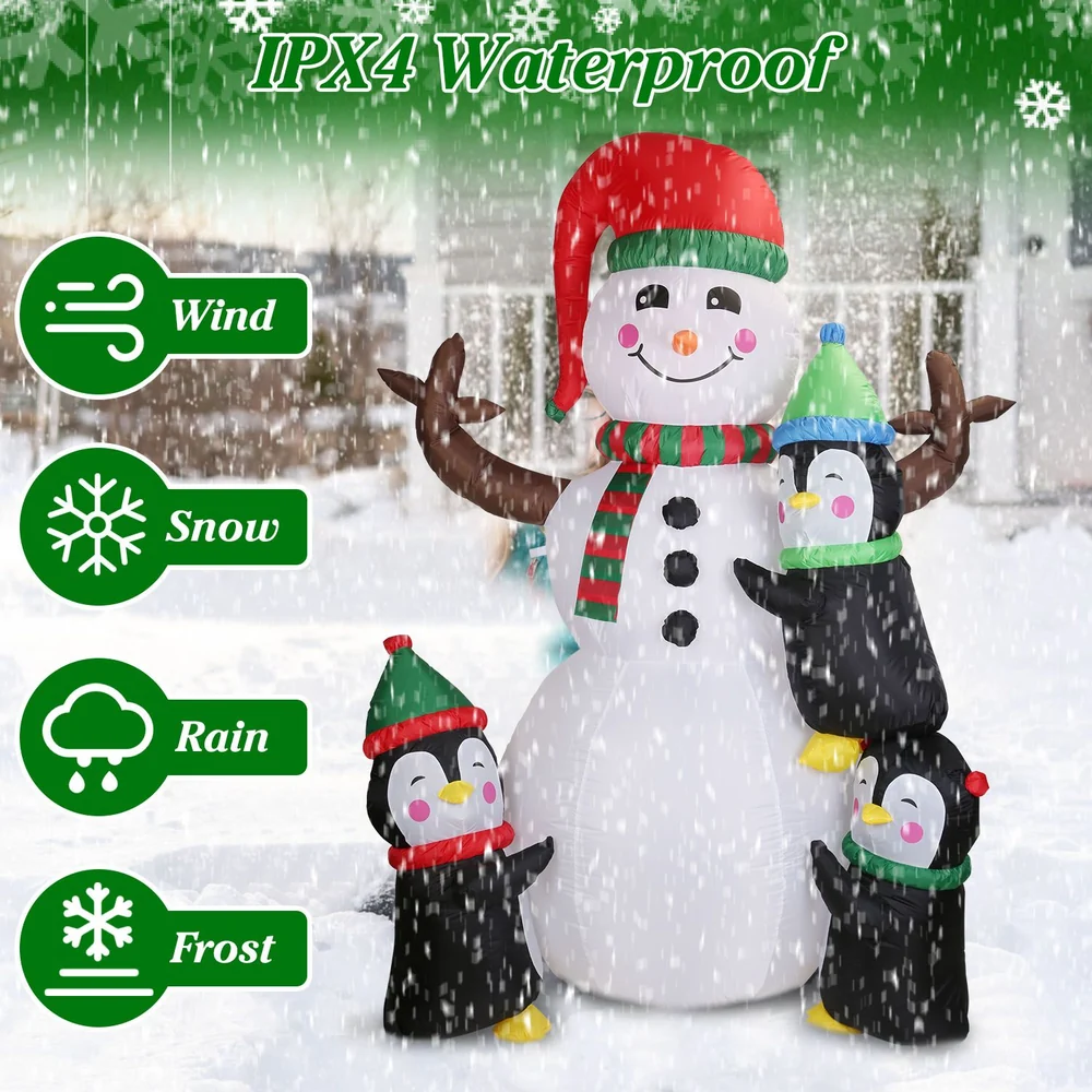 Inflatable snowman with three penguins, showcasing IPX4 waterproof features suitable for wind, snow, rain, and frost in a snowy outdoor setting.