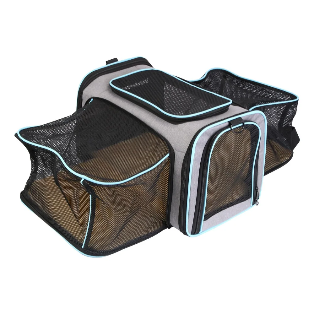 Ventilated pet carrier bag with a spacious interior and multiple mesh compartments for comfort and visibility while traveling.