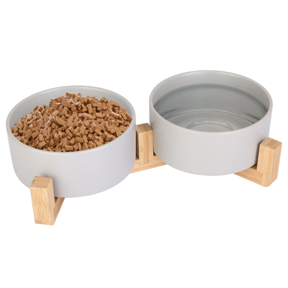 Double pet bowl set featuring a modern bamboo stand, one bowl filled with kibble, and the other with water.