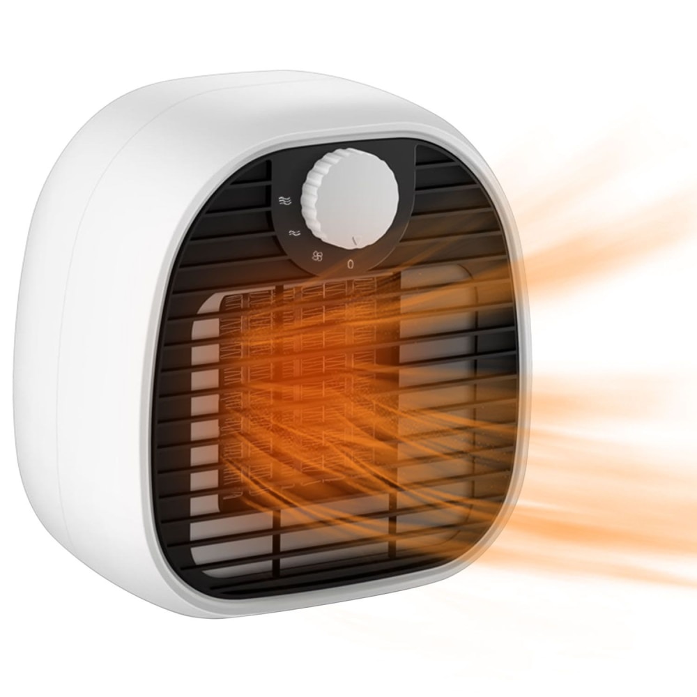 Compact white electric heater with adjustable temperature control and warm air blowing, ideal for personal use in small spaces.