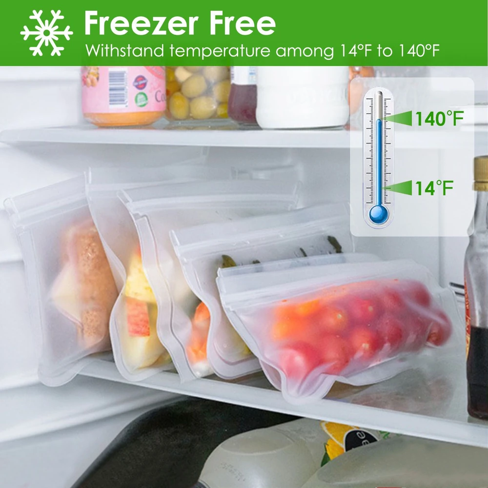 Reusable freezer bags holding assorted fruits and vegetables in a refrigerator, featuring a green "Freezer Free" label indicating temperature range from 14°F to 140°F.
