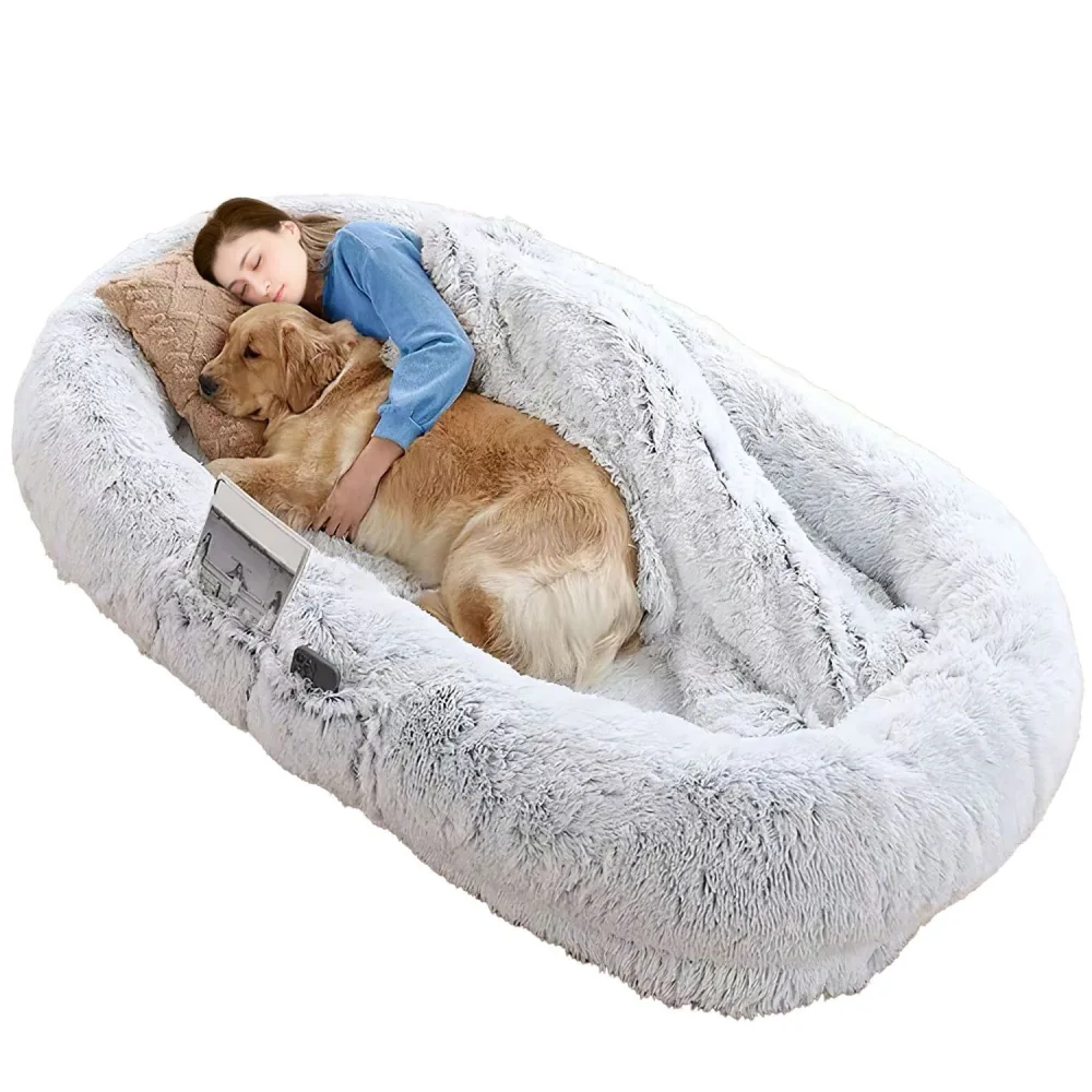 Cozy pet bed featuring a golden retriever nestled with a person, surrounded by soft, plush fabric and a pillow, ideal for promoting comfort and bonding moments.