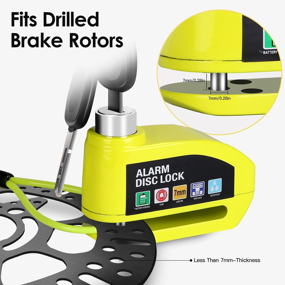 Alarm disc lock designed for drilled brake rotors, featuring a bright yellow color and clear labeling for battery operation, lock mechanism, and waterproof capabilities, with a key inserted for security demonstration.