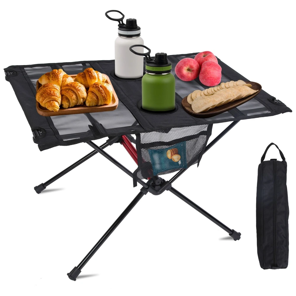 Portable folding camping table with croissants, apples, and drinks, showcasing a stylish mesh design and convenient storage pocket.