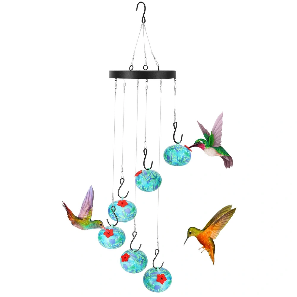 Colorful hummingbird feeder with six glass feeding globes, featuring vibrant floral designs, suspended on hooks with hummingbirds hovering nearby.
