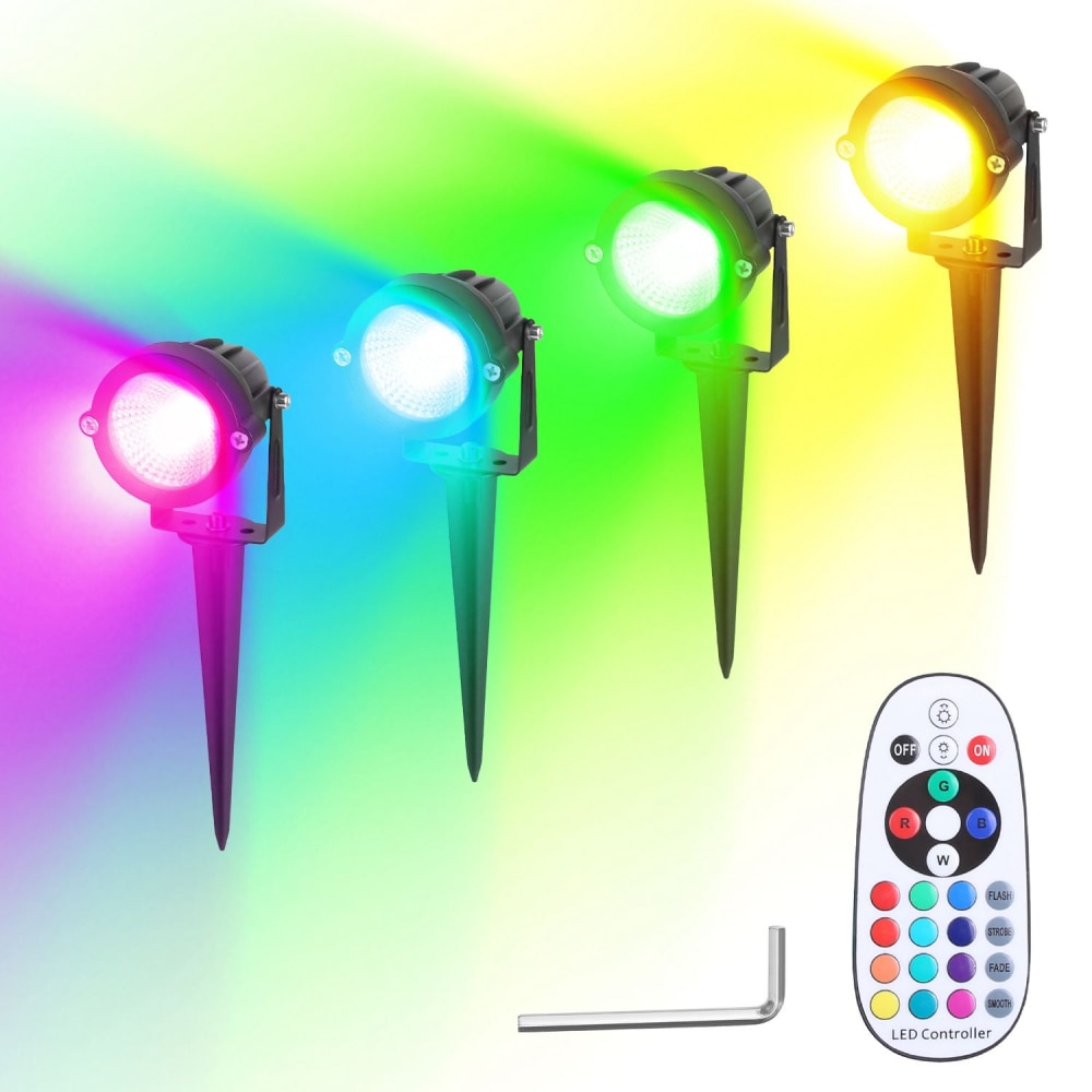 LED garden lights set with four color-changing spotlights, remote control, and adjustable stakes, casting vibrant rainbow hues on a textured background.