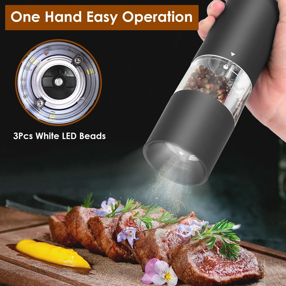 Electric pepper grinder being used with one hand to season gourmet steak on a wooden cutting board, LED light illuminating the pepper, and colorful garnishes enhancing the dish.