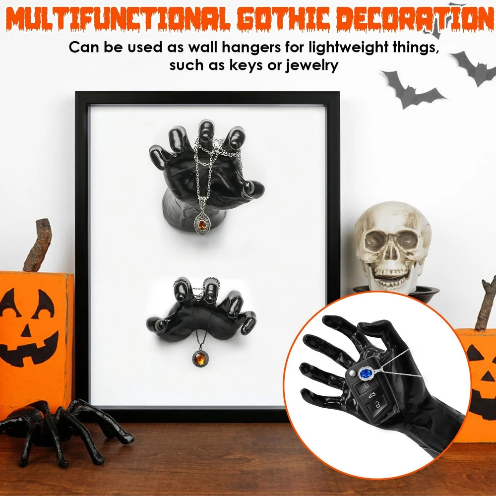 Multifunctional gothic wall hangers shaped like black hands, designed for displaying lightweight items such as jewelry and keys, featuring a stylish, spooky home decor aesthetic.