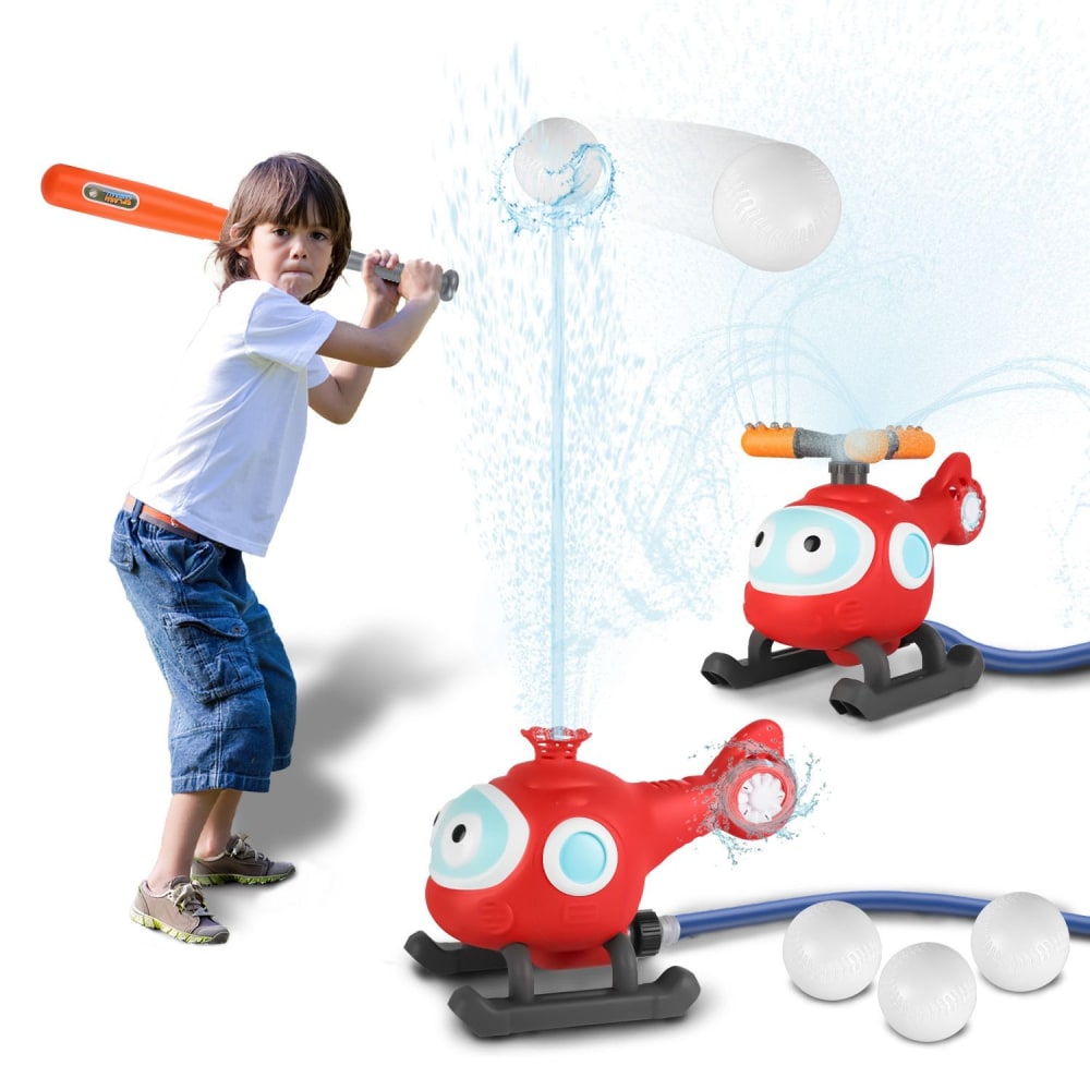 Child playing baseball with a colorful water-spraying toy helicopter and plastic balls in an outdoor setting.