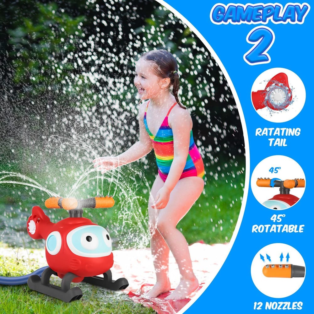 Child playing with a red helicopter-shaped water sprinkler, featuring a rotating tail and multiple nozzles, in a colorful striped swimsuit on a sunny day.