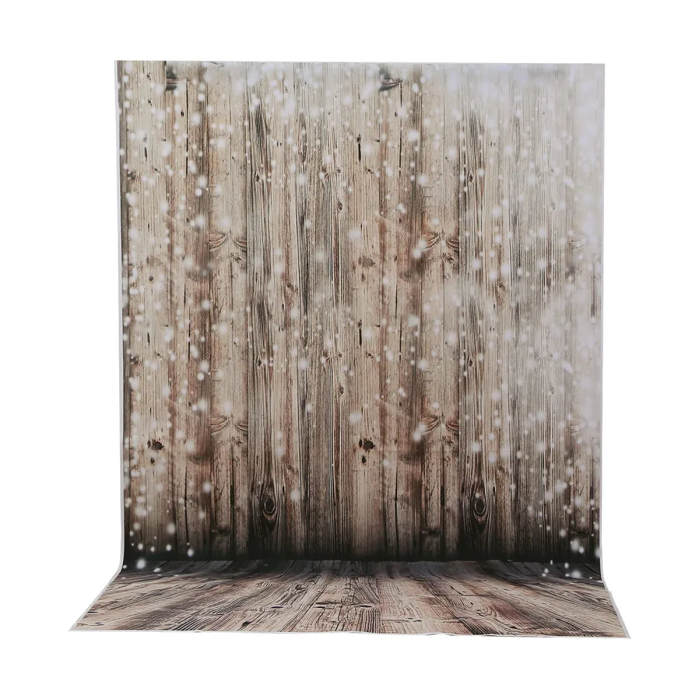 Winter-themed photography backdrop featuring a rustic wooden wall with a snow effect, ideal for holiday photoshoots.
