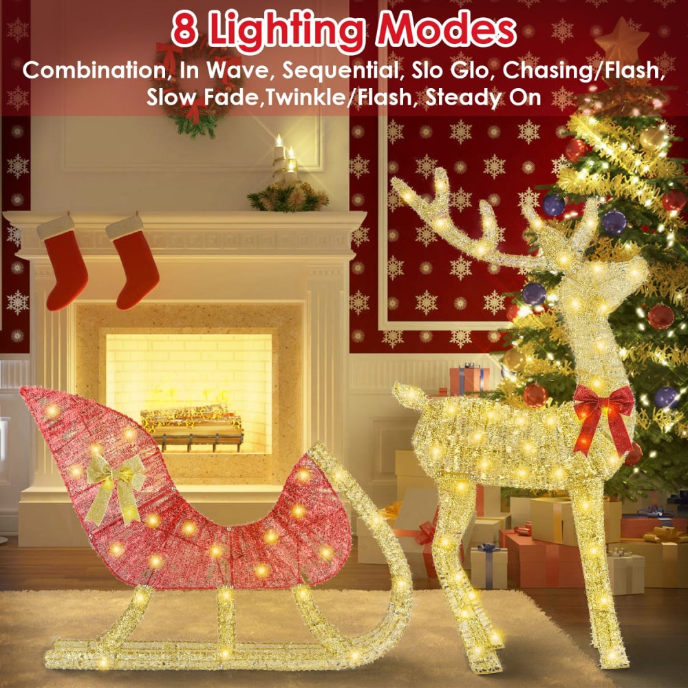 Decorative lit Christmas sleigh and reindeer with 8 lighting modes in a cozy holiday living room environment featuring a fireplace and a Christmas tree.