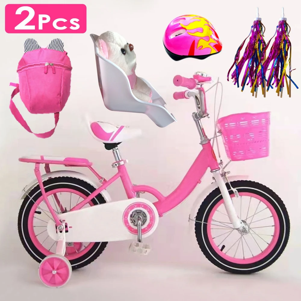 Pink children's bicycle with training wheels, featuring a white baby seat with a stuffed toy, matching pink helmet, colorful streamers, and a pink backpack.