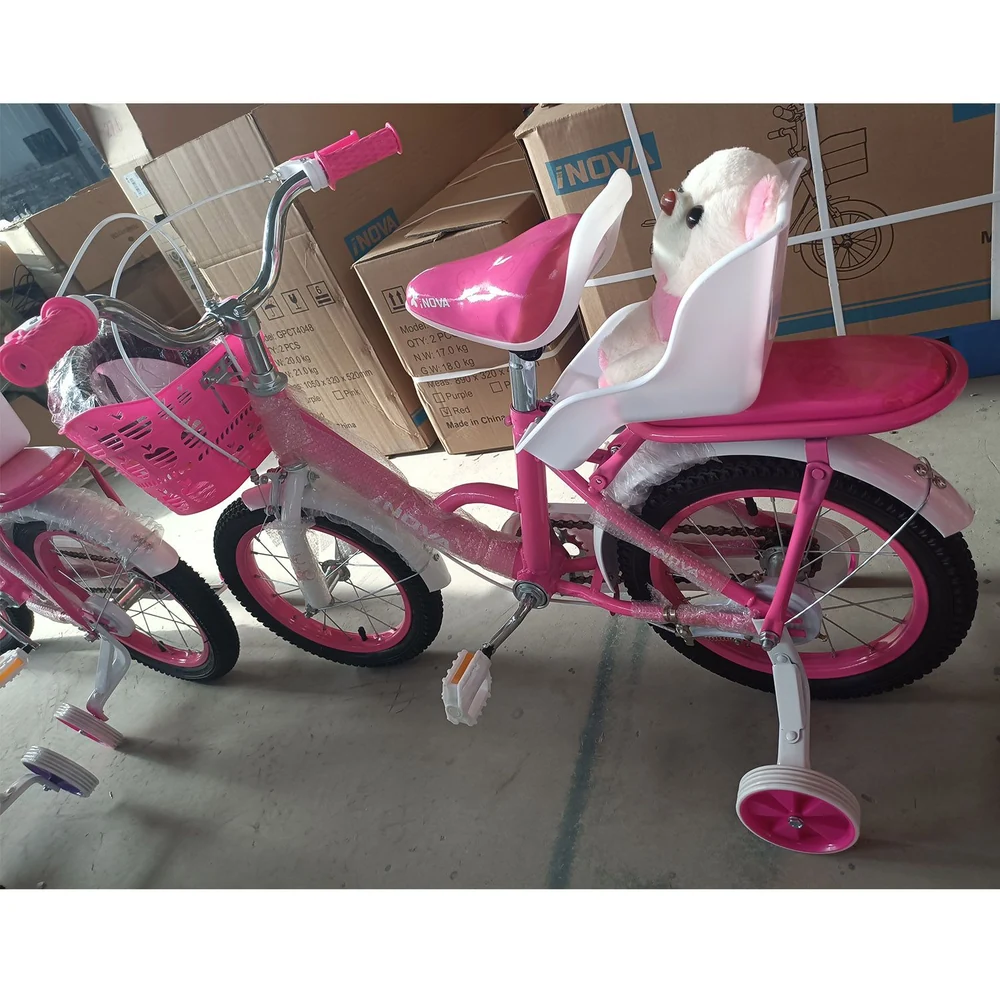 Pink children's bicycle with training wheels and a stuffed animal in the seat, showcasing a cute design perfect for young riders.